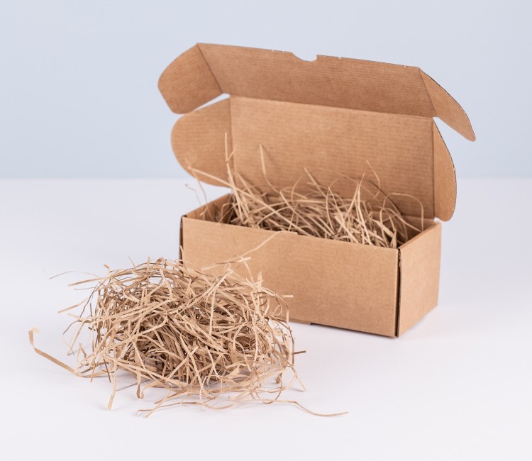 Copeaux de papier pour garniture de boîtes en carton