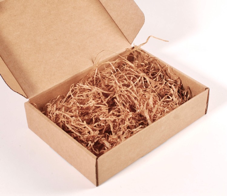Copeaux de papier pour garniture de boîtes en carton
